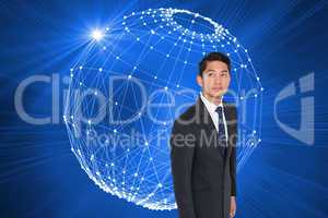 Composite image of serious asian businessman