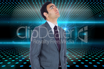 Composite image of unsmiling businessman standing