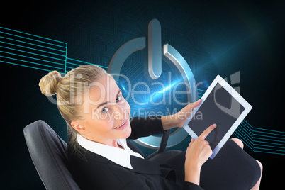 Composite image of businesswoman sitting on swivel chair with ta