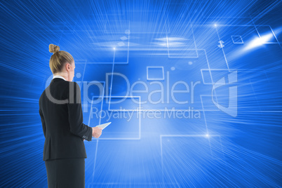 Composite image of businesswoman holding new tablet