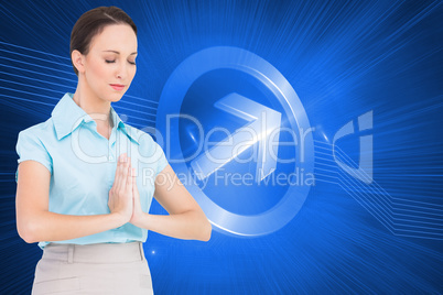 Composite image of peaceful young businesswoman praying