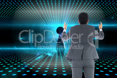 Composite image of businessman with arms raised