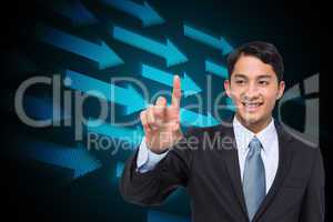 Composite image of smiling asian businessman pointing