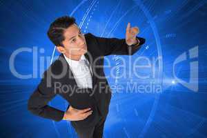 Composite image of unsmiling asian businessman pointing