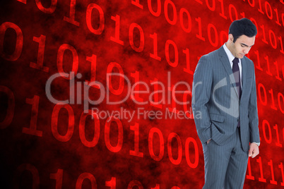 Composite image of unsmiling businessman standing