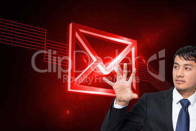 Composite image of unsmiling businessman holding and pointing