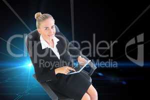 Composite image of businesswoman sitting on swivel chair with ta