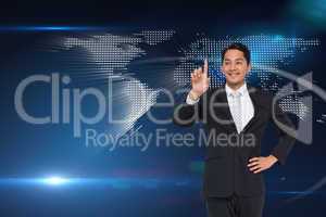 Composite image of smiling asian businessman pointing