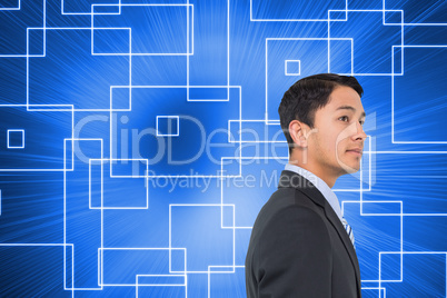 Composite image of serious asian businessman