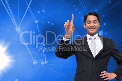 Composite image of smiling asian businessman pointing