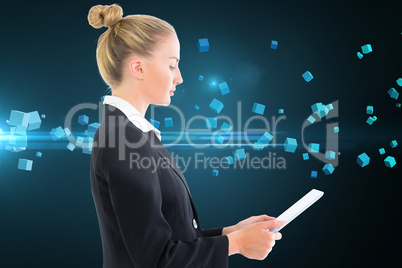 Composite image of businesswoman holding tablet