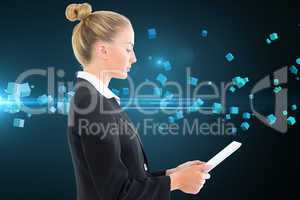 Composite image of businesswoman holding tablet