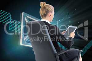 Composite image of businesswoman sitting on swivel chair with ta