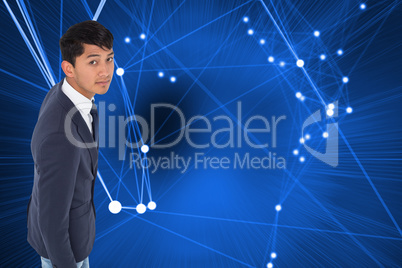 Composite image of unsmiling casual businessman walking