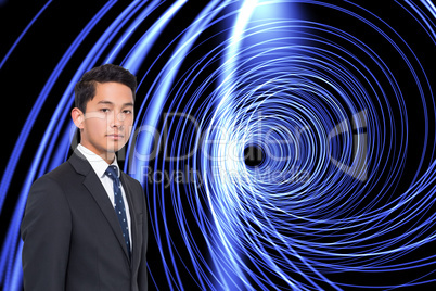 Composite image of futuristic shiny spiral on black background