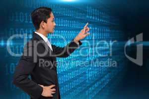 Composite image of unsmiling asian businessman pointing