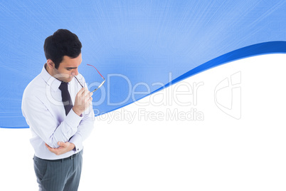 Composite image of unsmiling businessman holding glasses