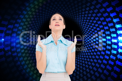 Composite image of concerned young businesswoman praying