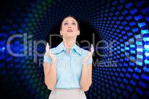 Composite image of concerned young businesswoman praying