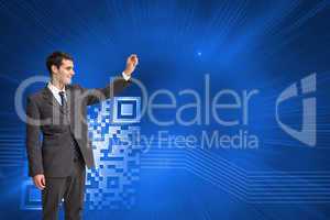 Composite image of smiling businessman holding something up in t