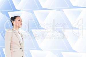 Composite image of unsmiling asian businesswoman walking