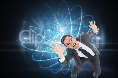 Composite image of excited businessman with arms raised