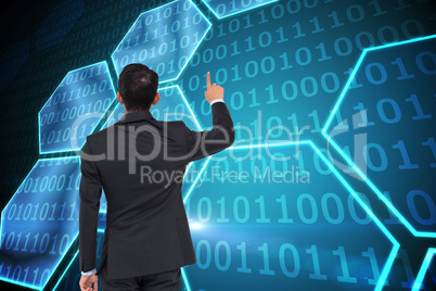 Composite image of asian businessman pointing