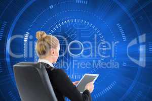 Composite image of businesswoman sitting on swivel chair with ta