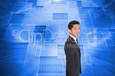 Composite image of smiling businessman looking at camera