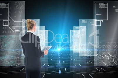 Composite image of businesswoman holding new tablet