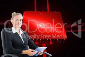 Composite image of businesswoman sitting on swivel chair with ta