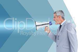 Composite image of businessman shouting in loudspeaker