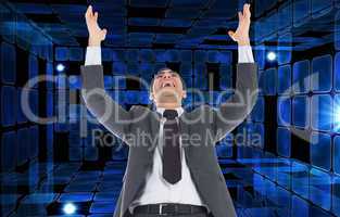 Composite image of excited businessman with arms raised