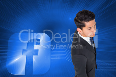 Composite image of serious asian businessman