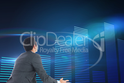 Composite image of businessman catching