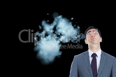 Composite image of unsmiling businessman standing