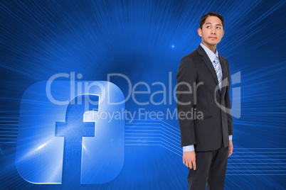 Composite image of serious asian businessman