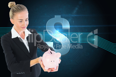 Composite image of businesswoman holding piggy bank