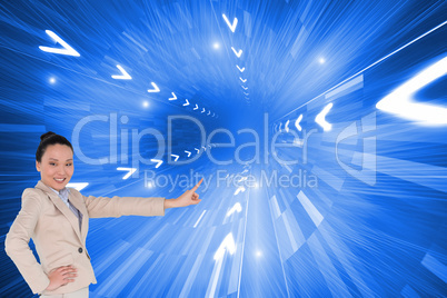 Composite image of smiling asian businesswoman pointing