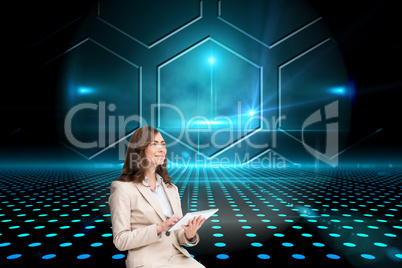 Composite image of businesswoman holding tablet and looking up