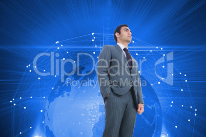 Composite image of unsmiling businessman standing