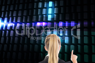 Composite image of business woman pointing somewhere