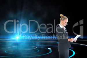 Composite image of businesswoman holding new tablet