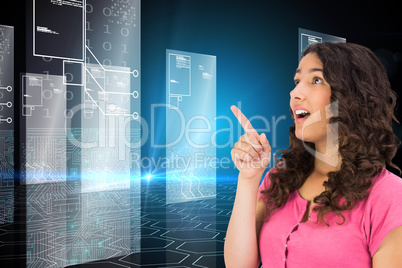 Composite image of surprised brown haired woman pointing out