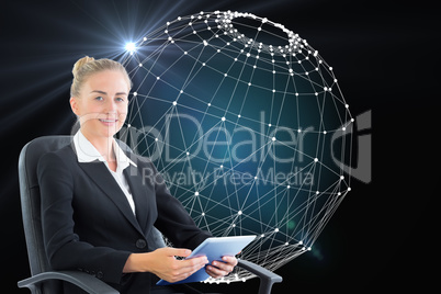 Composite image of businesswoman sitting on swivel chair with ta