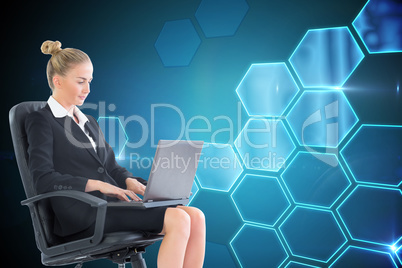 Composite image of businesswoman sitting on swivel chair with la