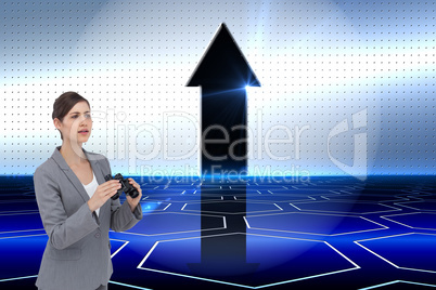 Composite image of curious young businesswoman with binoculars