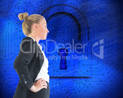 Composite image of businesswoman standing with hands on hips