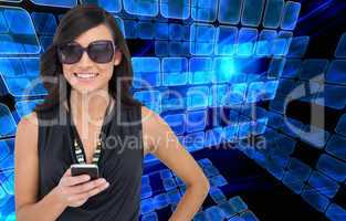 Composite image of happy brunette holding smartphone