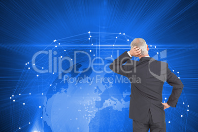 Composite image of rear view of doubtful mature businessman